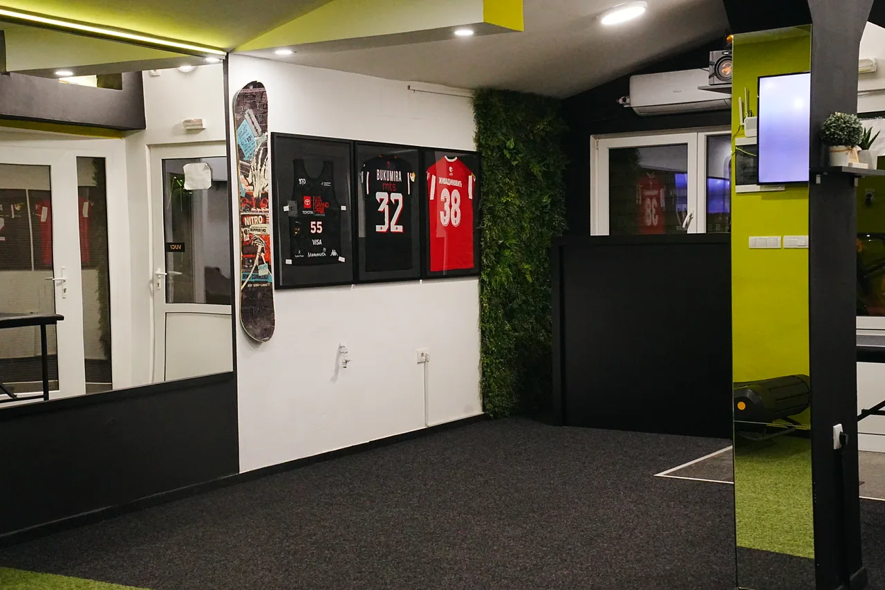 The Dramićanin Academy training space with framed sports jerseys.