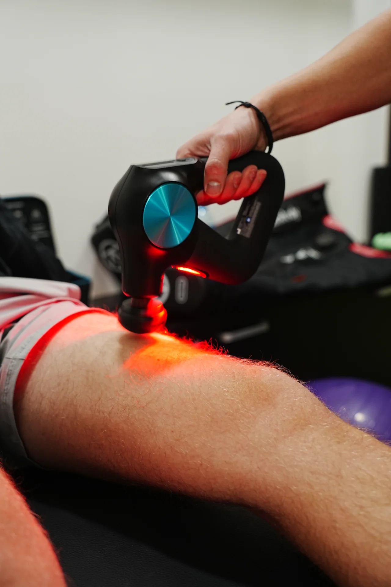 A massage device is used during recovery in the Academy training zone.